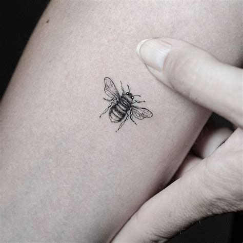 minimalist honey bee tattoo.